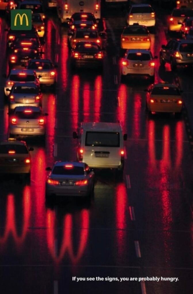 Another creative marketing campaign for McDonalds where the rear lights of the cars makes the McDonalds Logo on the wet road